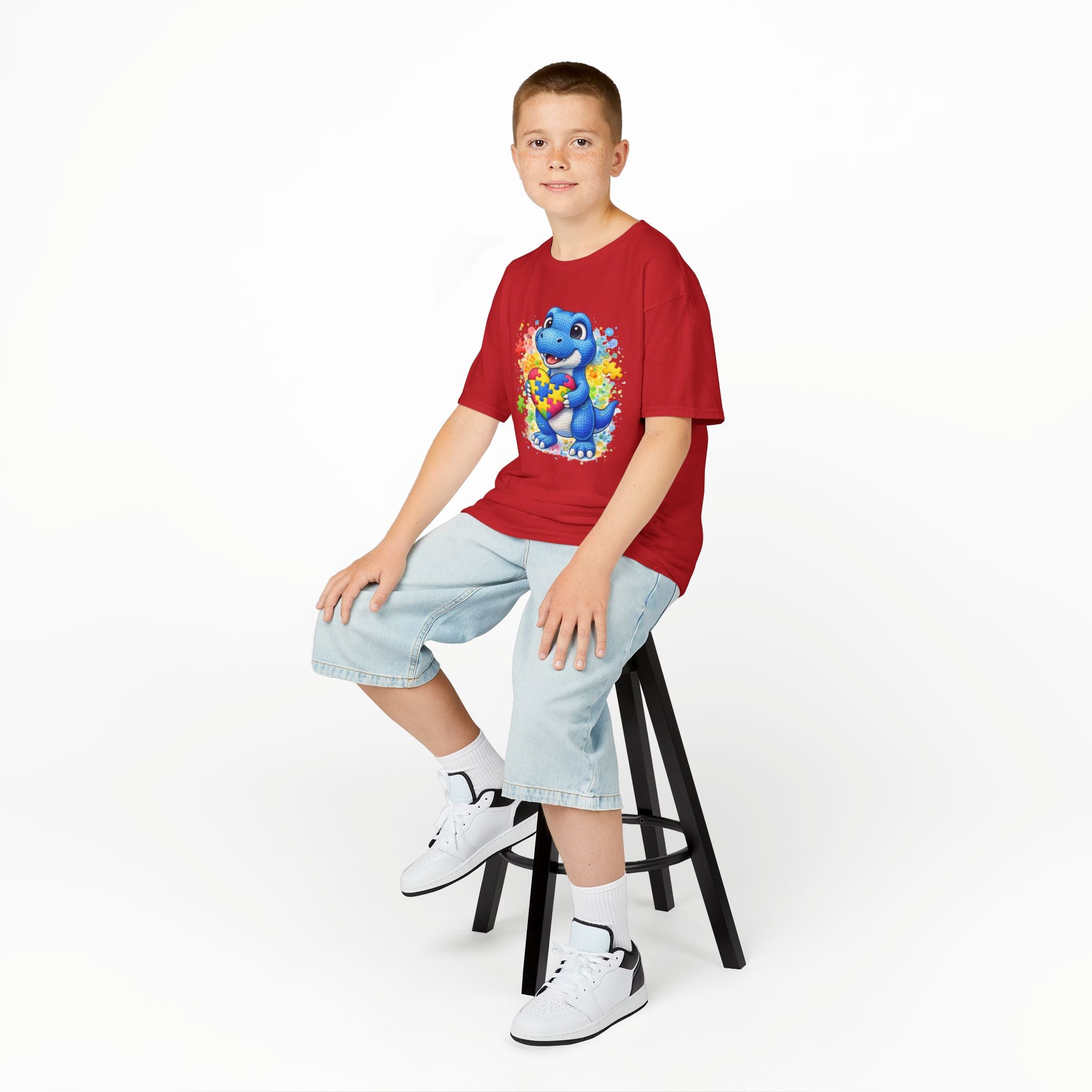 Kids T‑Shirt — Cute Blue Dinosaur Holding Puzzle Heart (Autism Awareness)