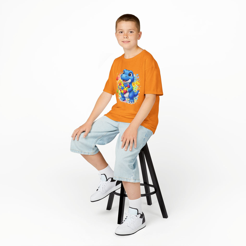 Kids T‑Shirt — Cute Blue Dinosaur Holding Puzzle Heart (Autism Awareness)
