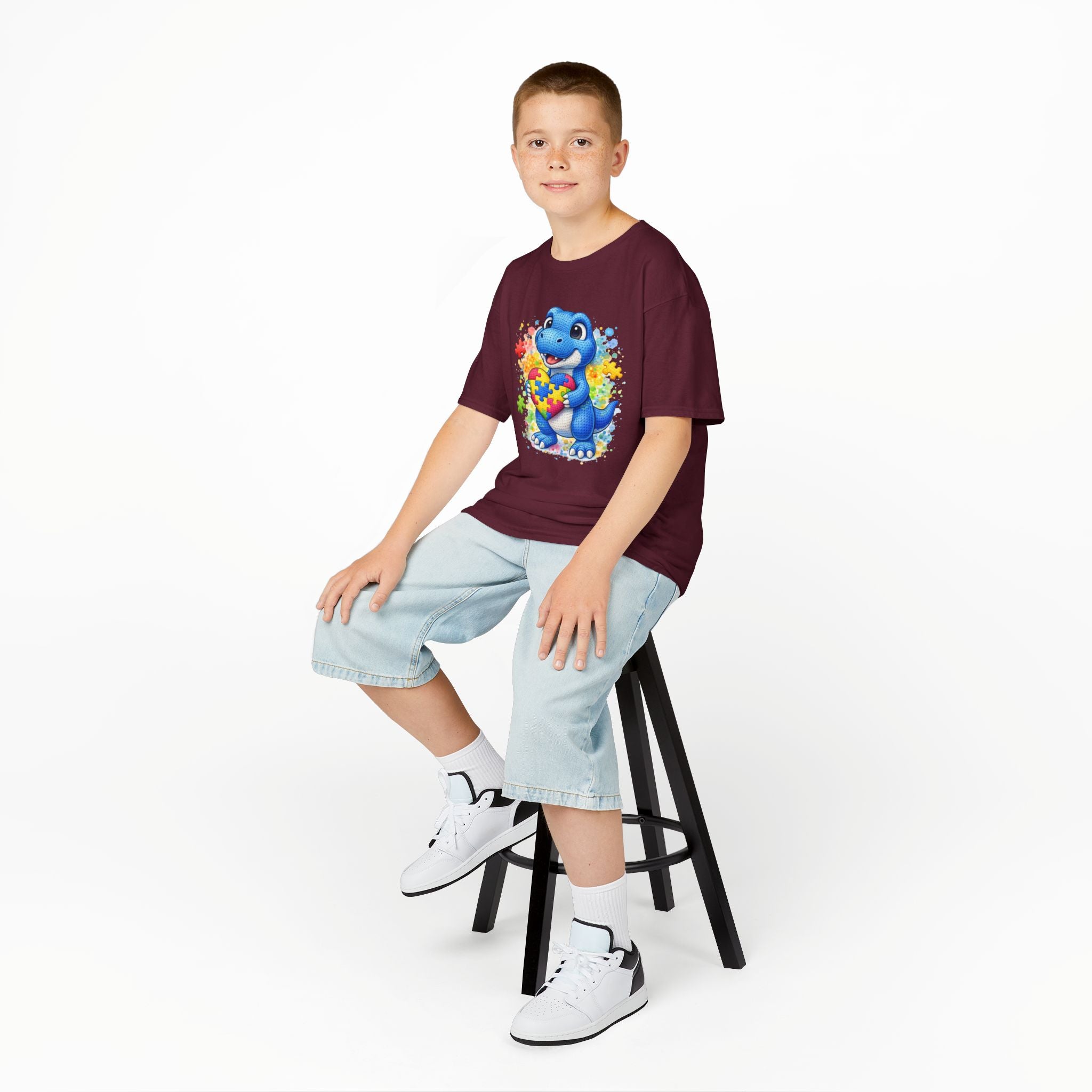 Kids T‑Shirt — Cute Blue Dinosaur Holding Puzzle Heart (Autism Awareness)