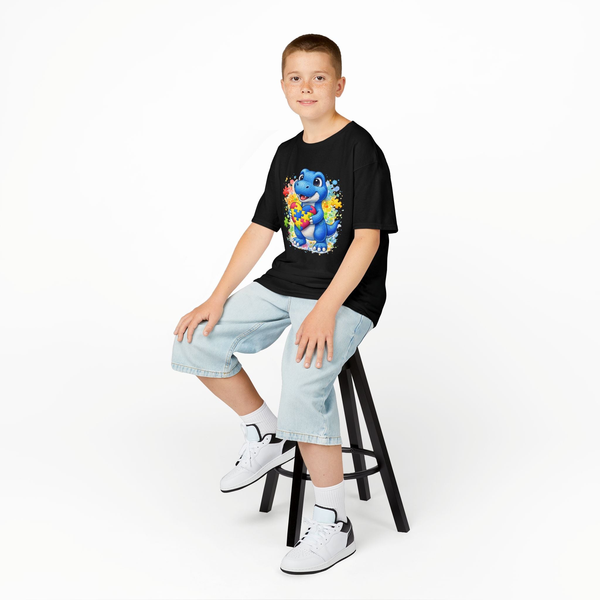 Kids T‑Shirt — Cute Blue Dinosaur Holding Puzzle Heart (Autism Awareness)